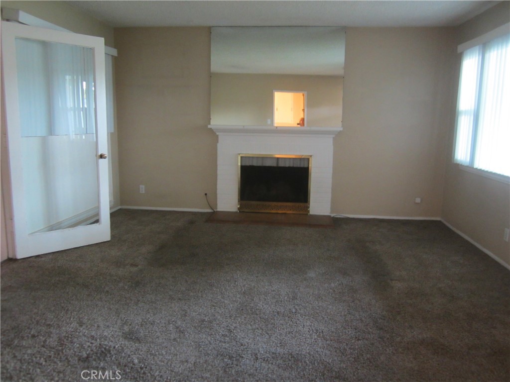 6725 De Anza Avenue Riverside, CA 92506 - Photo 9 of 25 a view of empty room with a fireplace