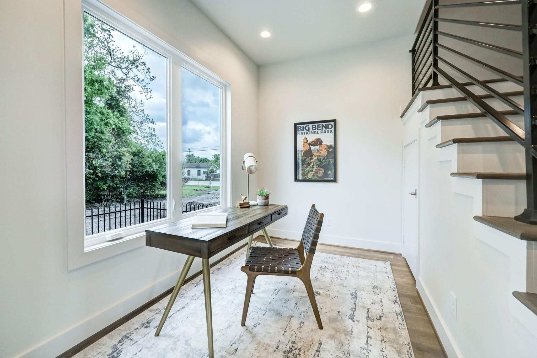 3827 Arlington Street Houston, TX 77018 - Photo 7 of 39 a view of a workspace with furniture and a window