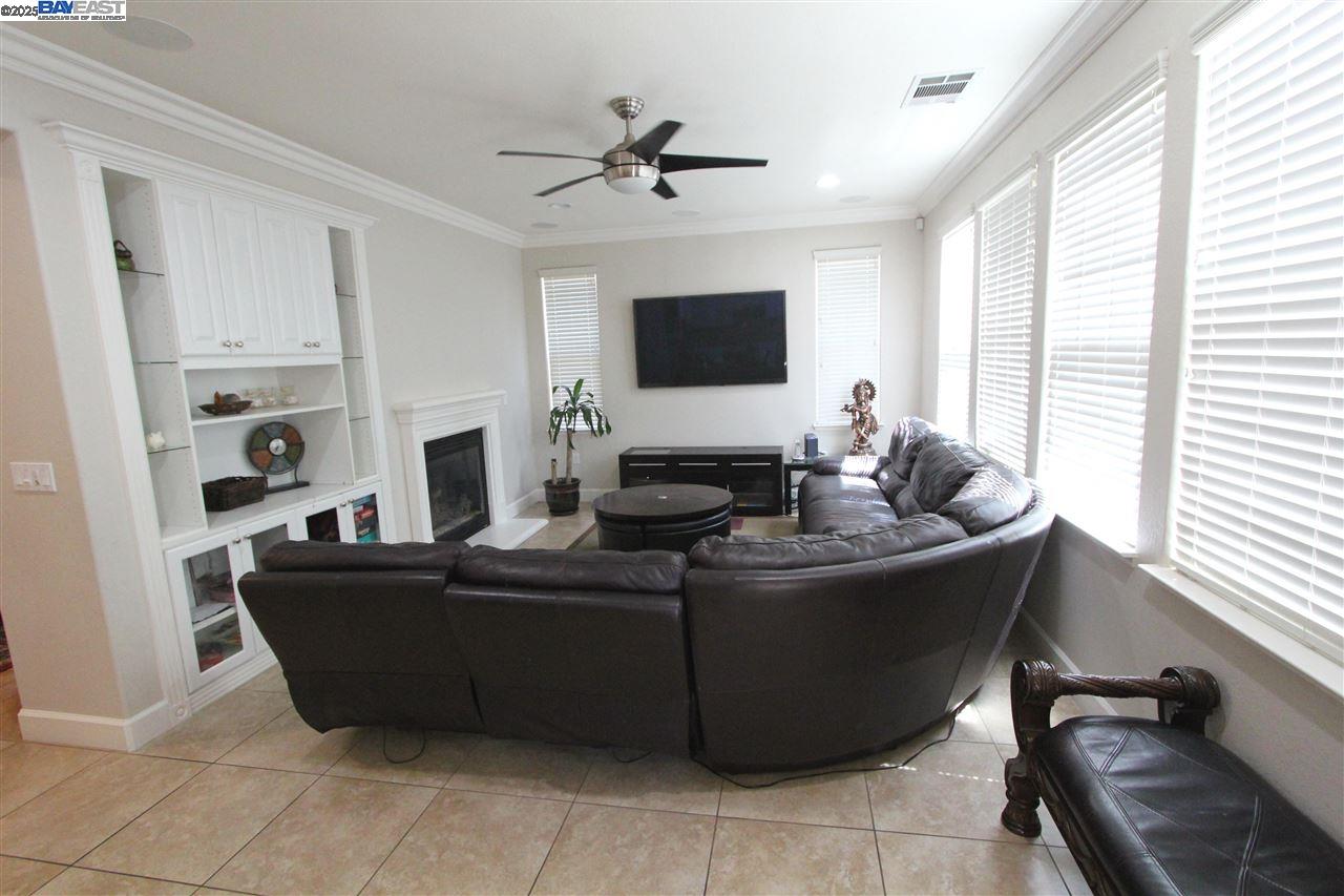 5199 Salerno Drive Dublin, CA 94568 - Photo 4 of 20 a living room with furniture a flat screen tv and a large window
