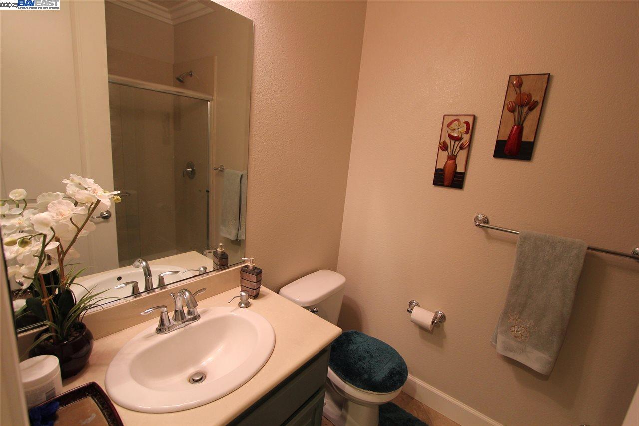 5199 Salerno Drive Dublin, CA 94568 - Photo 8 of 20 a bathroom with a sink mirror and toilet