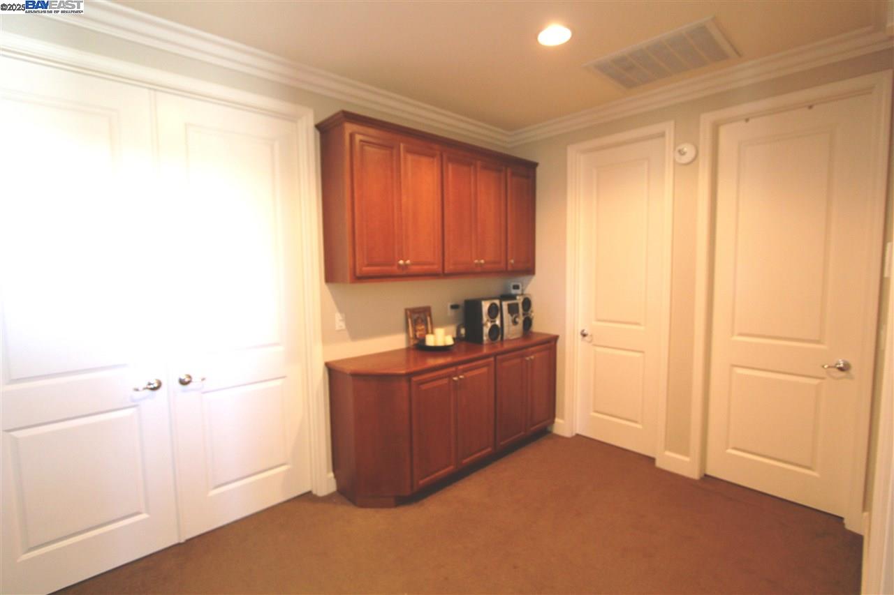 5199 Salerno Drive Dublin, CA 94568 - Photo 9 of 20 a room with cabinets and window