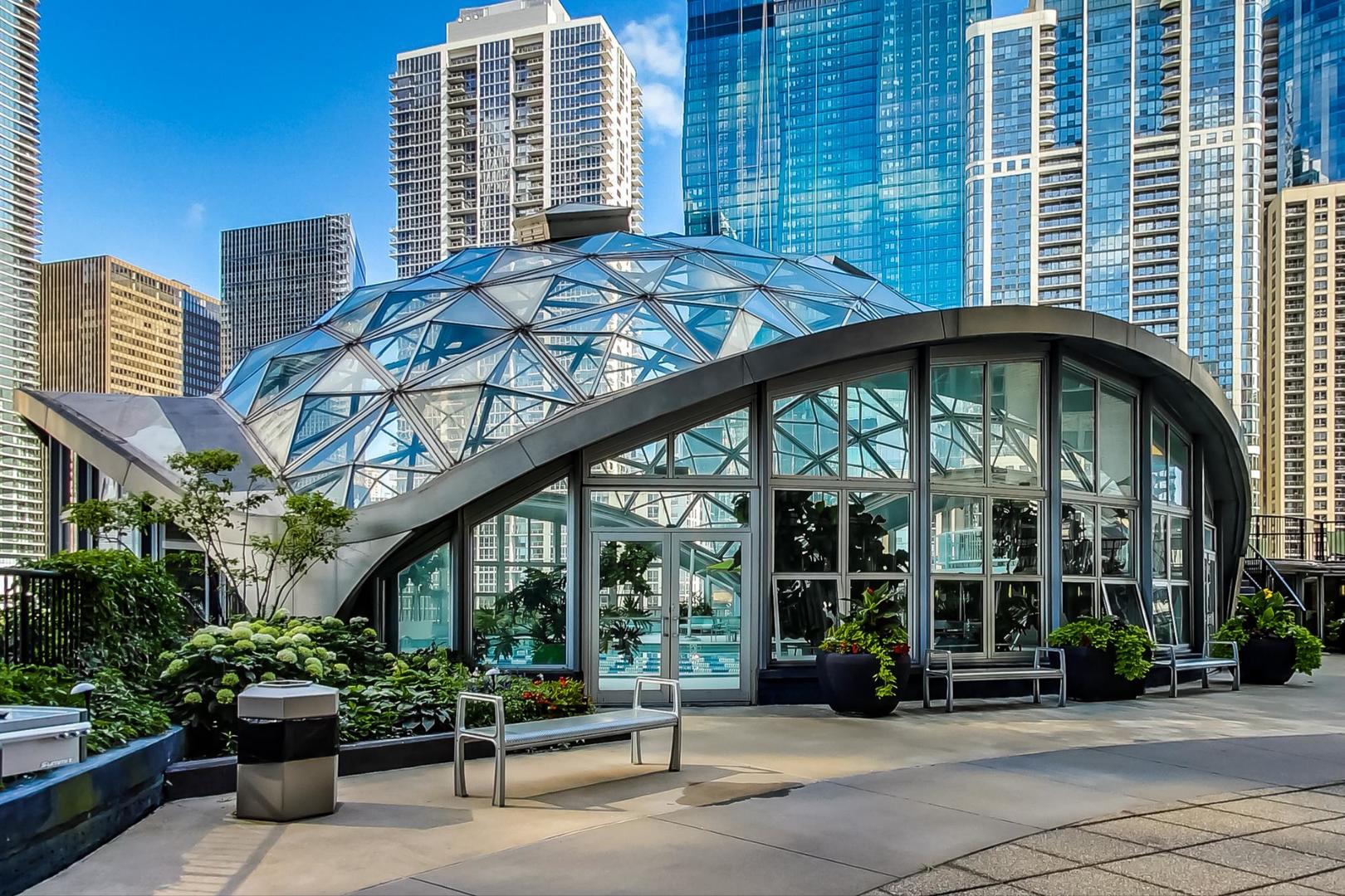 400 East Randolph Street, Unit 3321 Chicago, IL 60601 - Photo 16 of 19 a front view of a building with garden