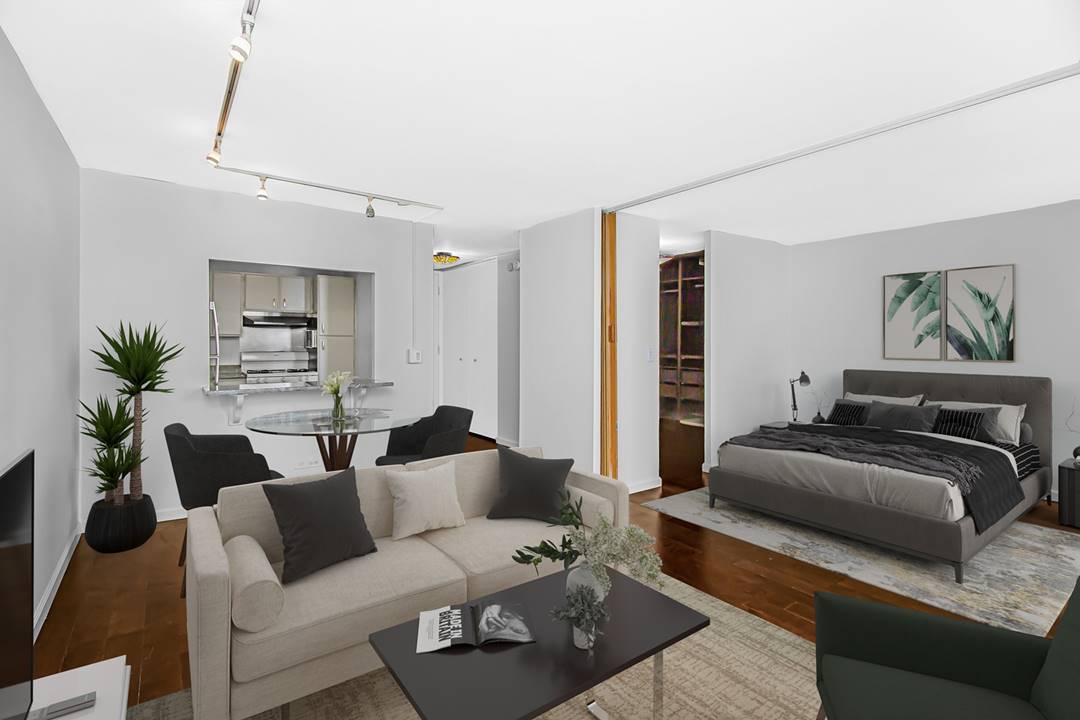 400 East Randolph Street, Unit 3321 Chicago, IL 60601 - Photo 2 of 19 a living room with furniture and a couch