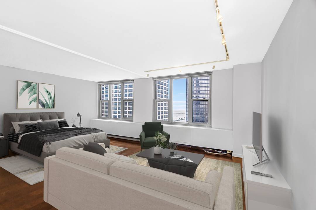 400 East Randolph Street, Unit 3321 Chicago, IL 60601 - Photo 3 of 19 a living room with furniture and a large window