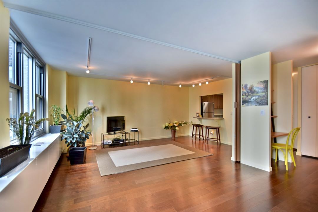 400 East Randolph Street, Unit 3321 Chicago, IL 60601 - Photo 9 of 19 a living room with furniture and a flat screen tv