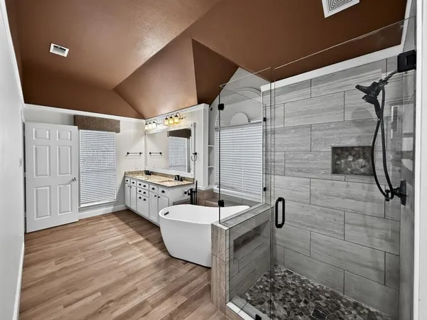 a bathroom with a sink toilet and shower
