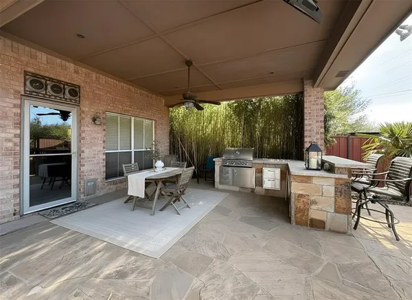 a view of a house with a backyard