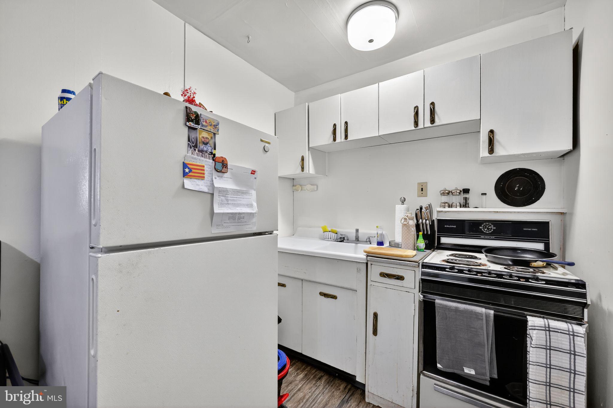 101 Main Street Roebling, NJ 08554 - Photo 11 of 55 a white refrigerator freezer sitting inside of a kitchen