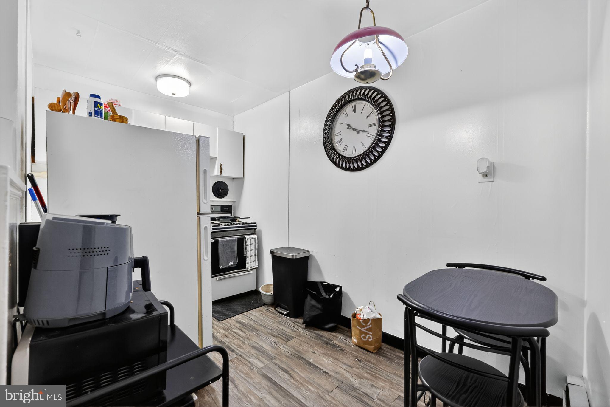 101 Main Street Roebling, NJ 08554 - Photo 12 of 55 a view of a room with chairs wooden floor and a clock