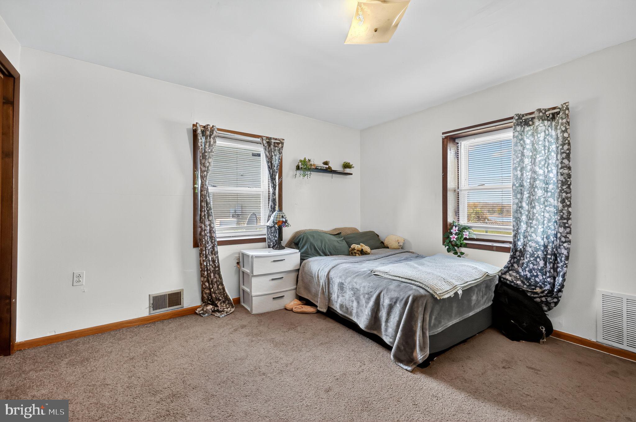 101 Main Street Roebling, NJ 08554 - Photo 25 of 55 a bedroom with a bed and a window