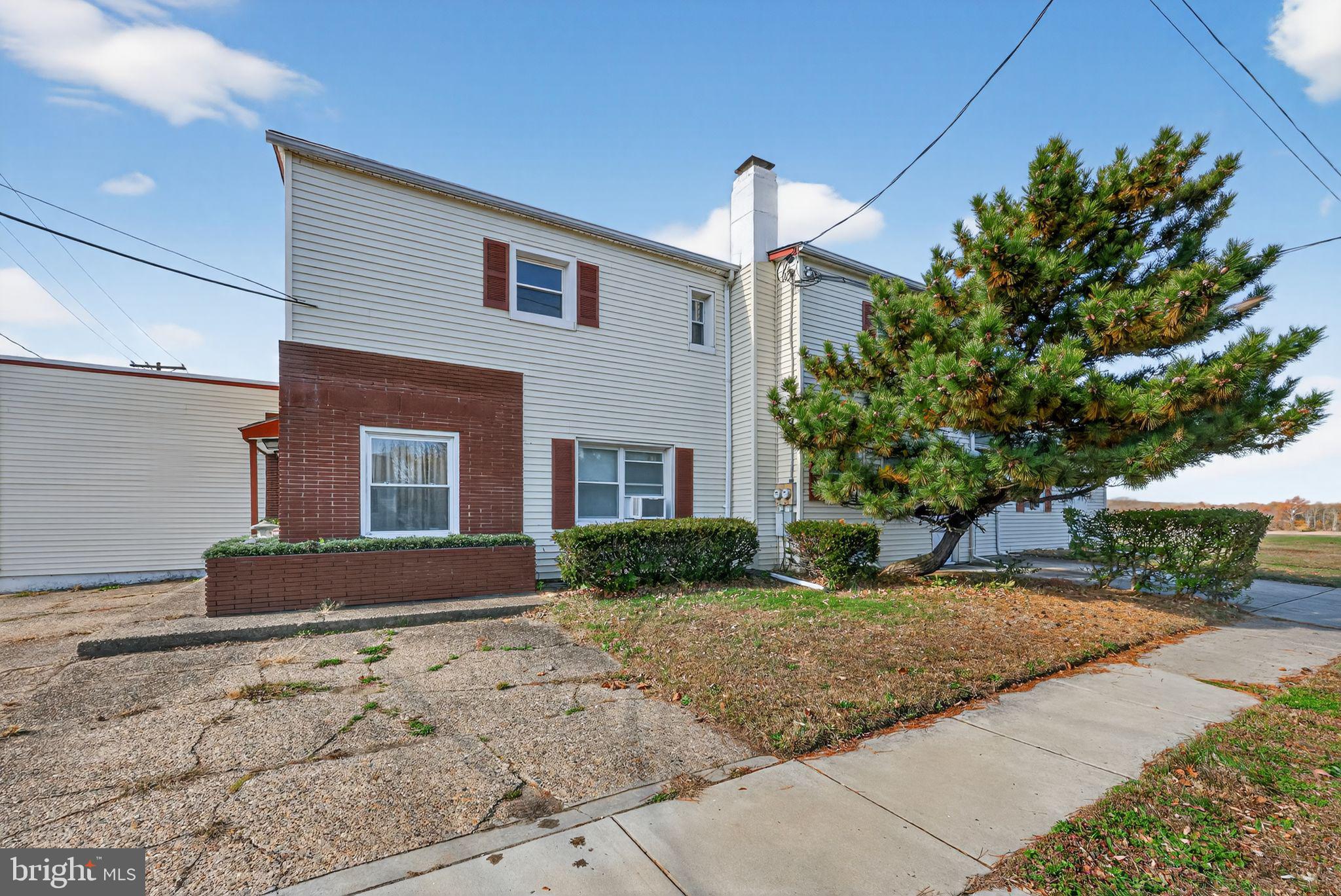 101 Main Street Roebling, NJ 08554 - Photo 3 of 55 a front view of a house with a yard