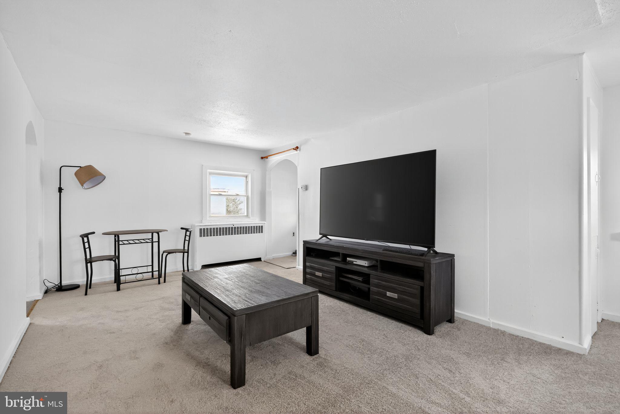101 Main Street Roebling, NJ 08554 - Photo 31 of 55 a living room with furniture and a flat screen tv
