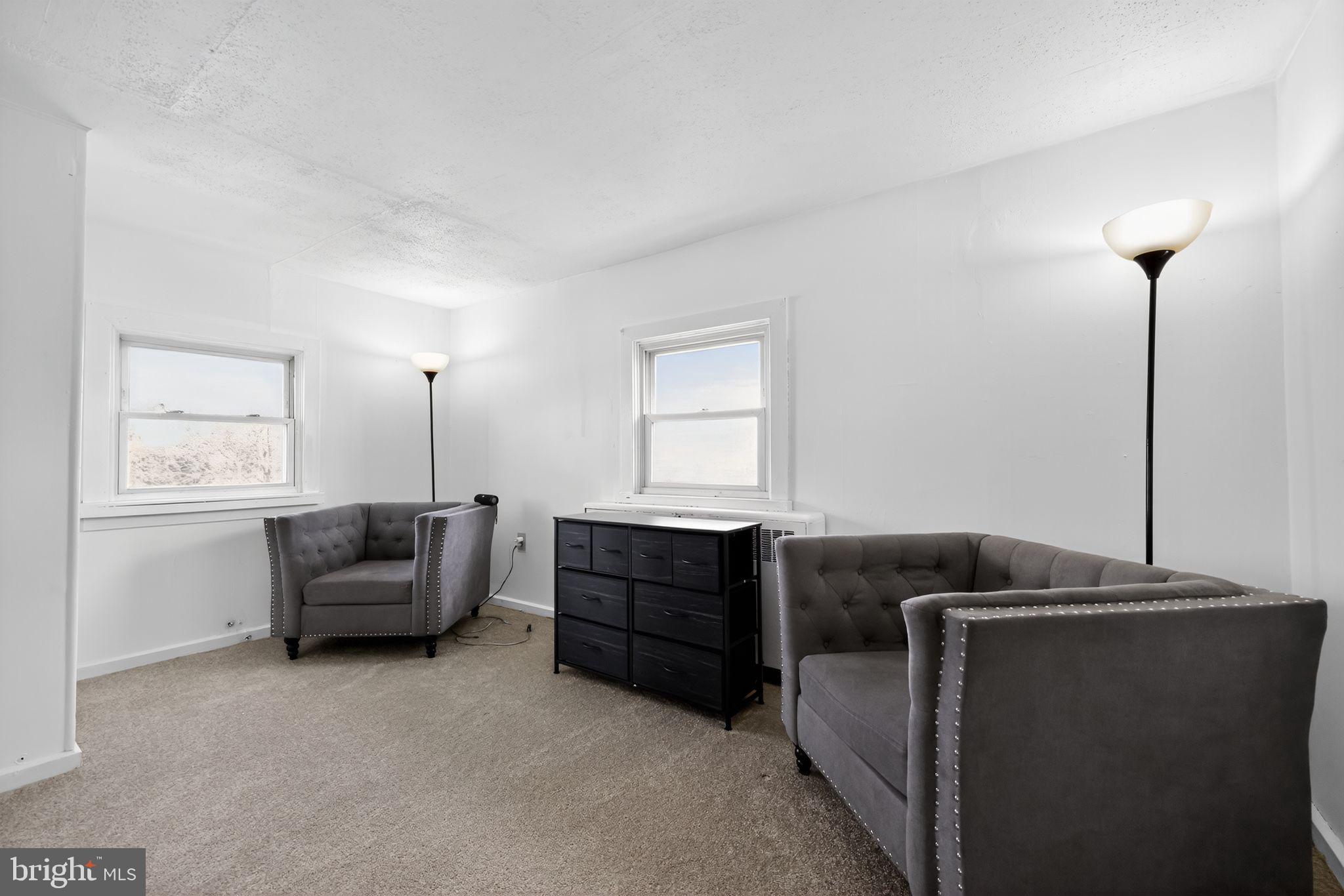 101 Main Street Roebling, NJ 08554 - Photo 32 of 55 a bedroom with a bed and a couch