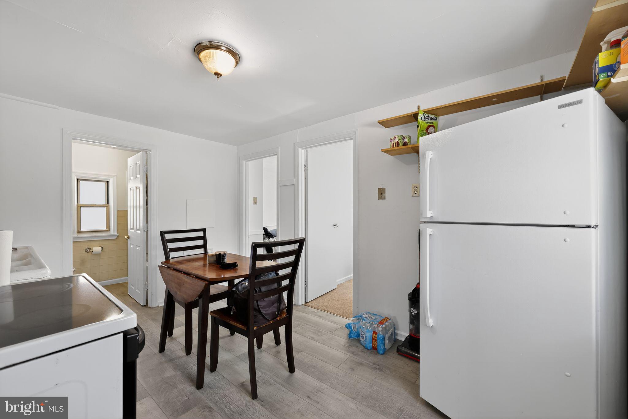 101 Main Street Roebling, NJ 08554 - Photo 34 of 55 a dining room with furniture and a refrigerator