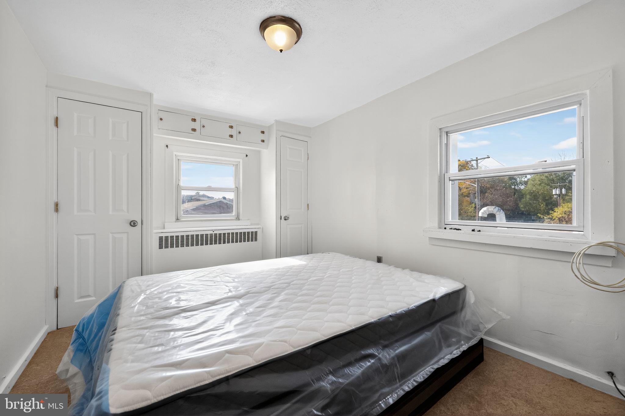 101 Main Street Roebling, NJ 08554 - Photo 36 of 55 a bedroom with a bed and a window