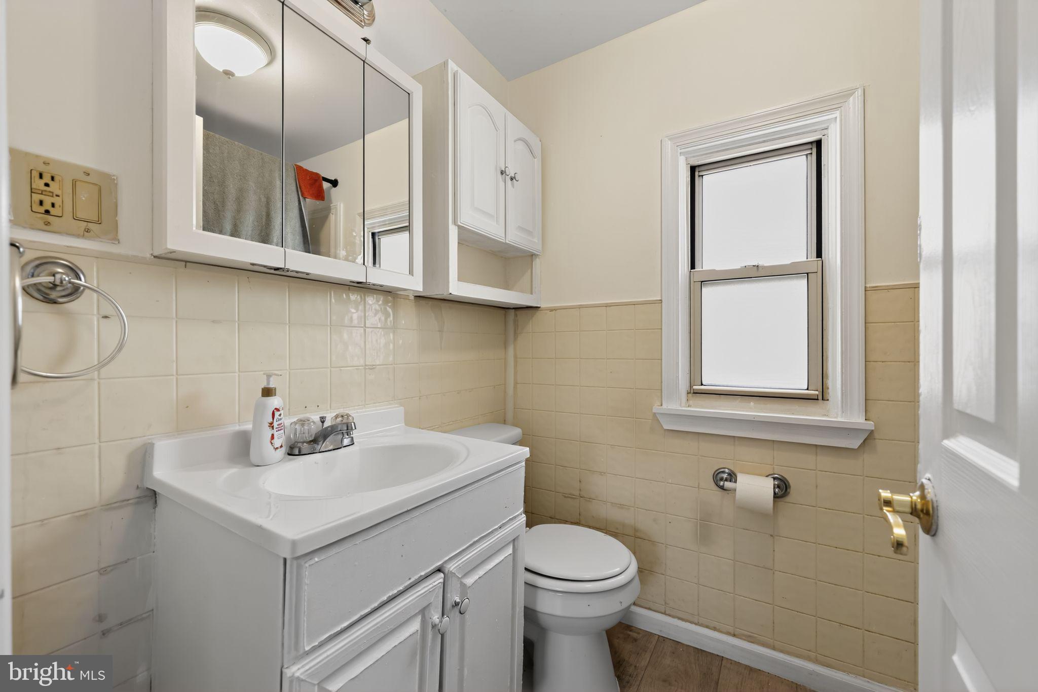 101 Main Street Roebling, NJ 08554 - Photo 37 of 55 a bathroom with a sink toilet and vanity