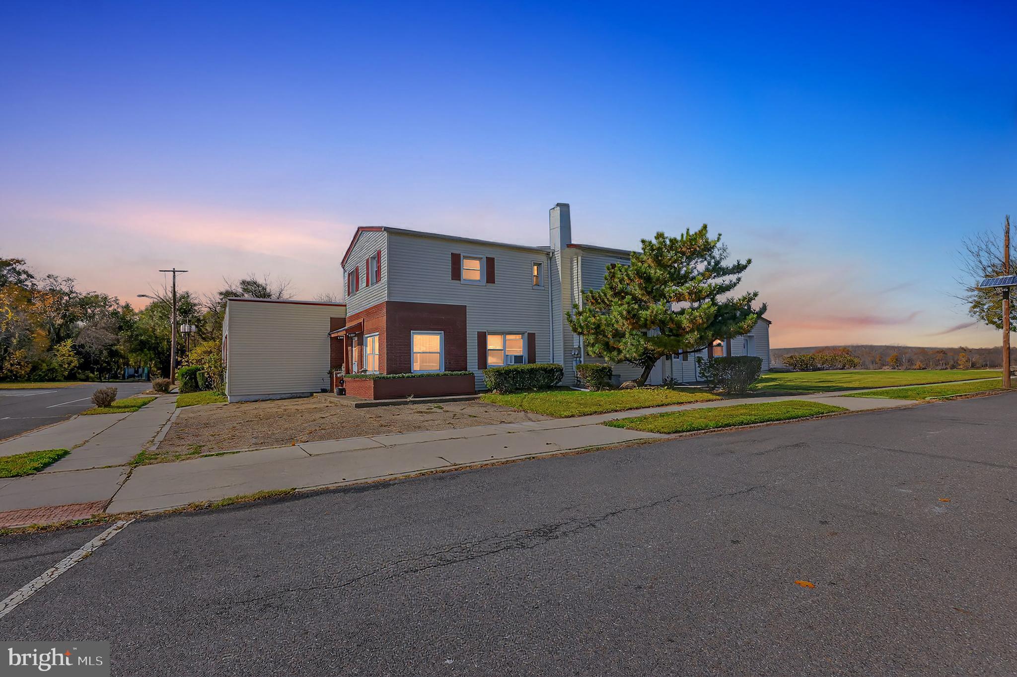 101 Main Street Roebling, NJ 08554 - Photo 4 of 55 a view of a house with a yard and a street