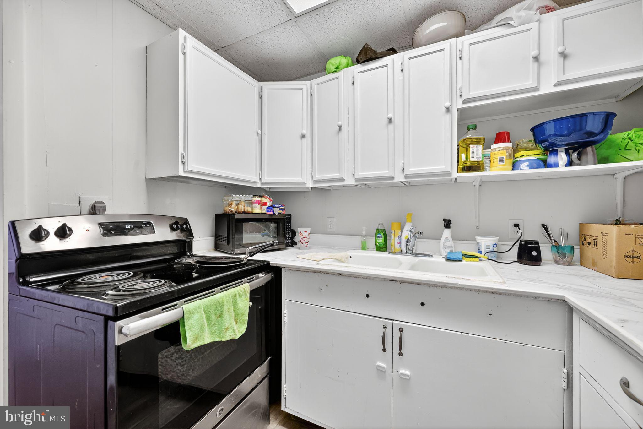 101 Main Street Roebling, NJ 08554 - Photo 41 of 55 a kitchen with cabinets and appliances