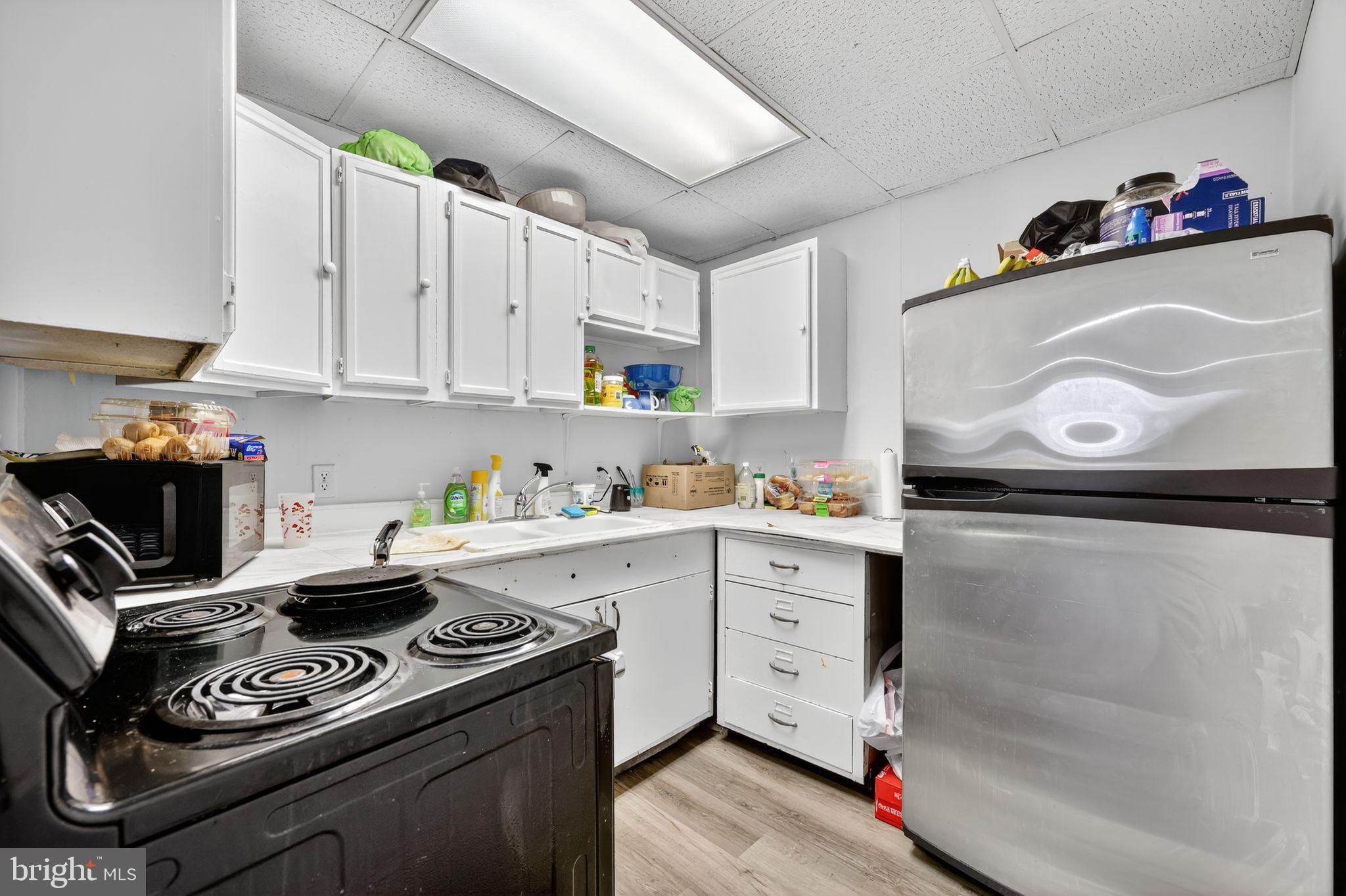 101 Main Street Roebling, NJ 08554 - Photo 42 of 55 a kitchen with a stove and a refrigerator