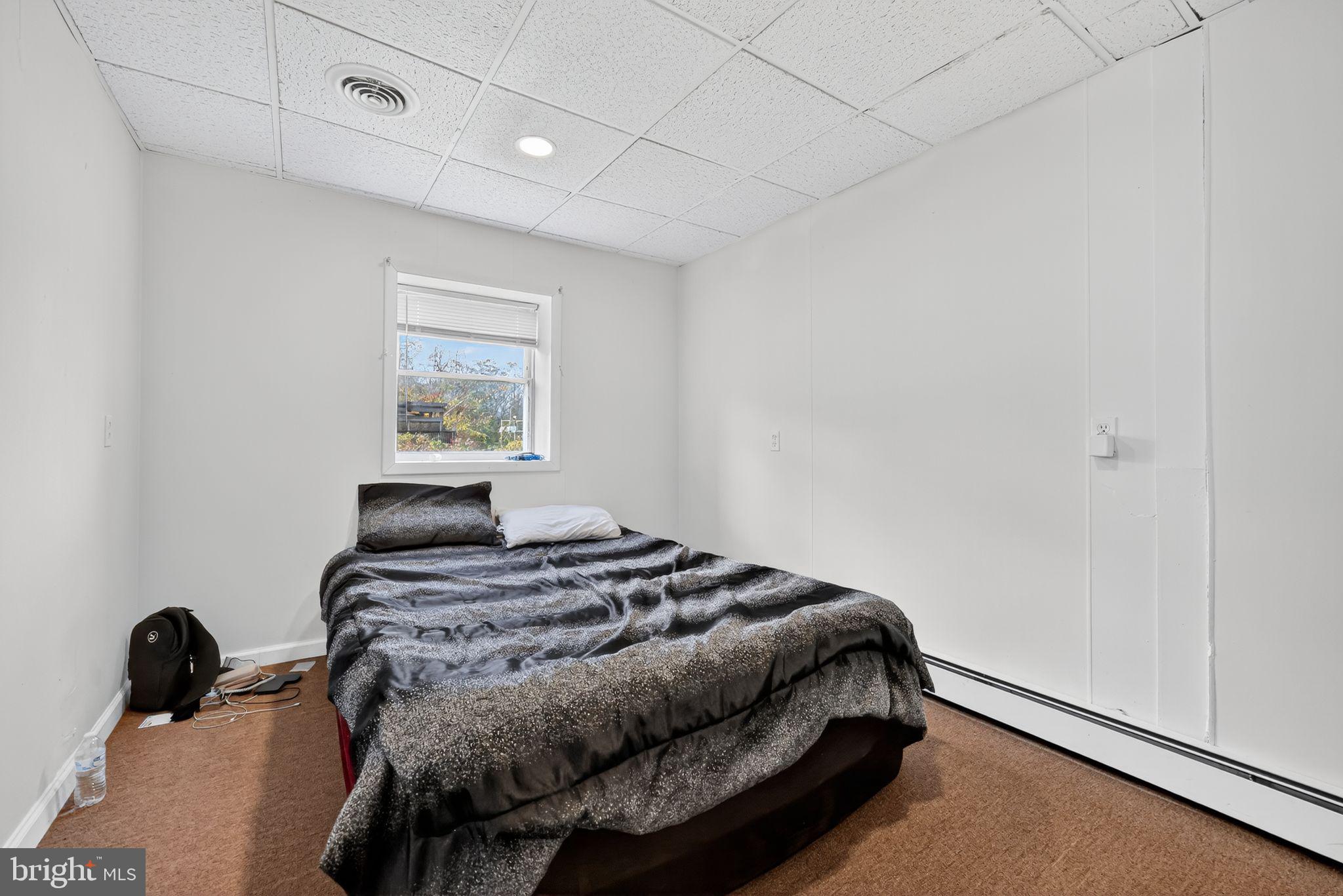 101 Main Street Roebling, NJ 08554 - Photo 43 of 55 a bedroom with a bed and a window