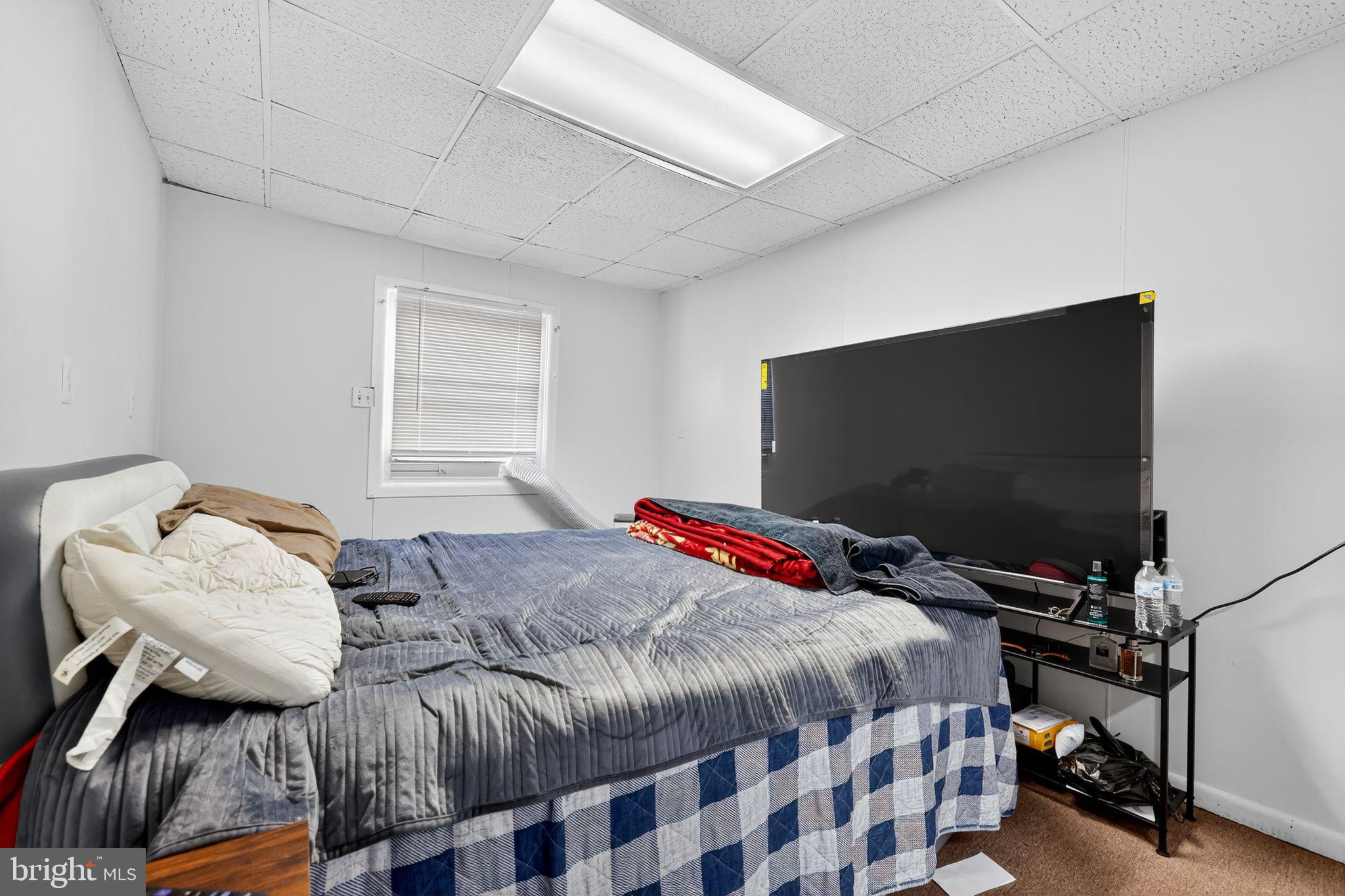 101 Main Street Roebling, NJ 08554 - Photo 44 of 55 a bedroom with a bed and a flat screen tv