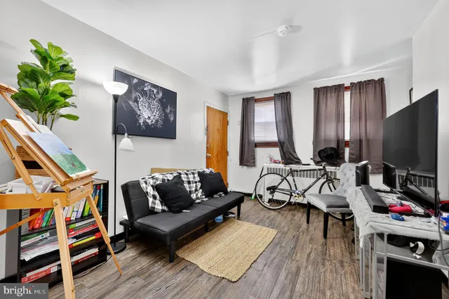 a bathroom with a sink and mirror with toilet