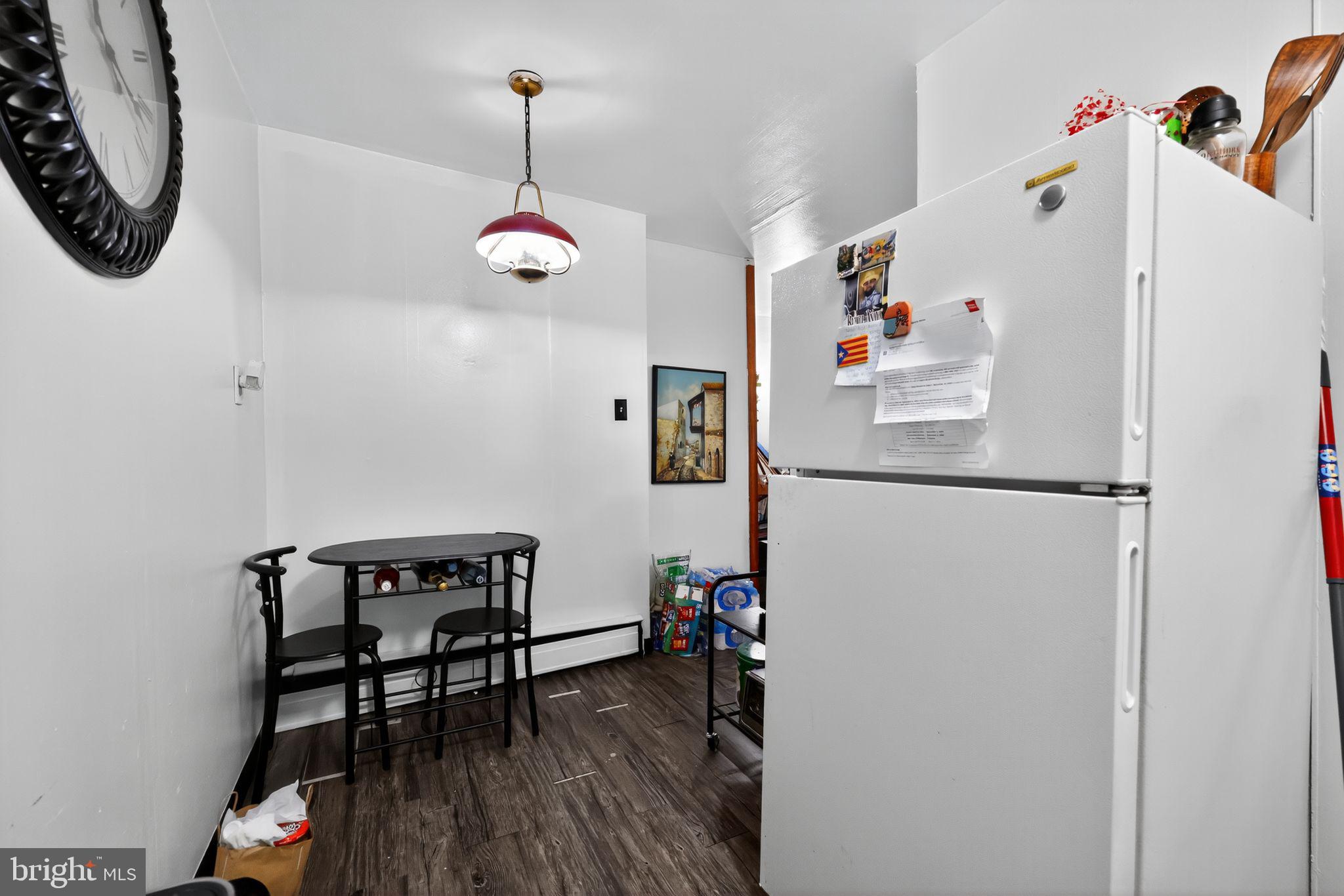 101 Main Street Roebling, NJ 08554 - Photo 10 of 55 a room with a refrigerator and a table