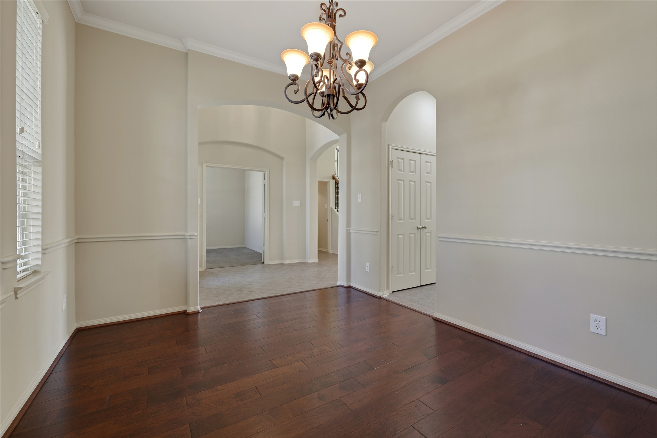 19815 Stanton Lake Drive Cypress, TX 77433 - Photo 11 of 50 a view of a chandelier in big room with wooden floor