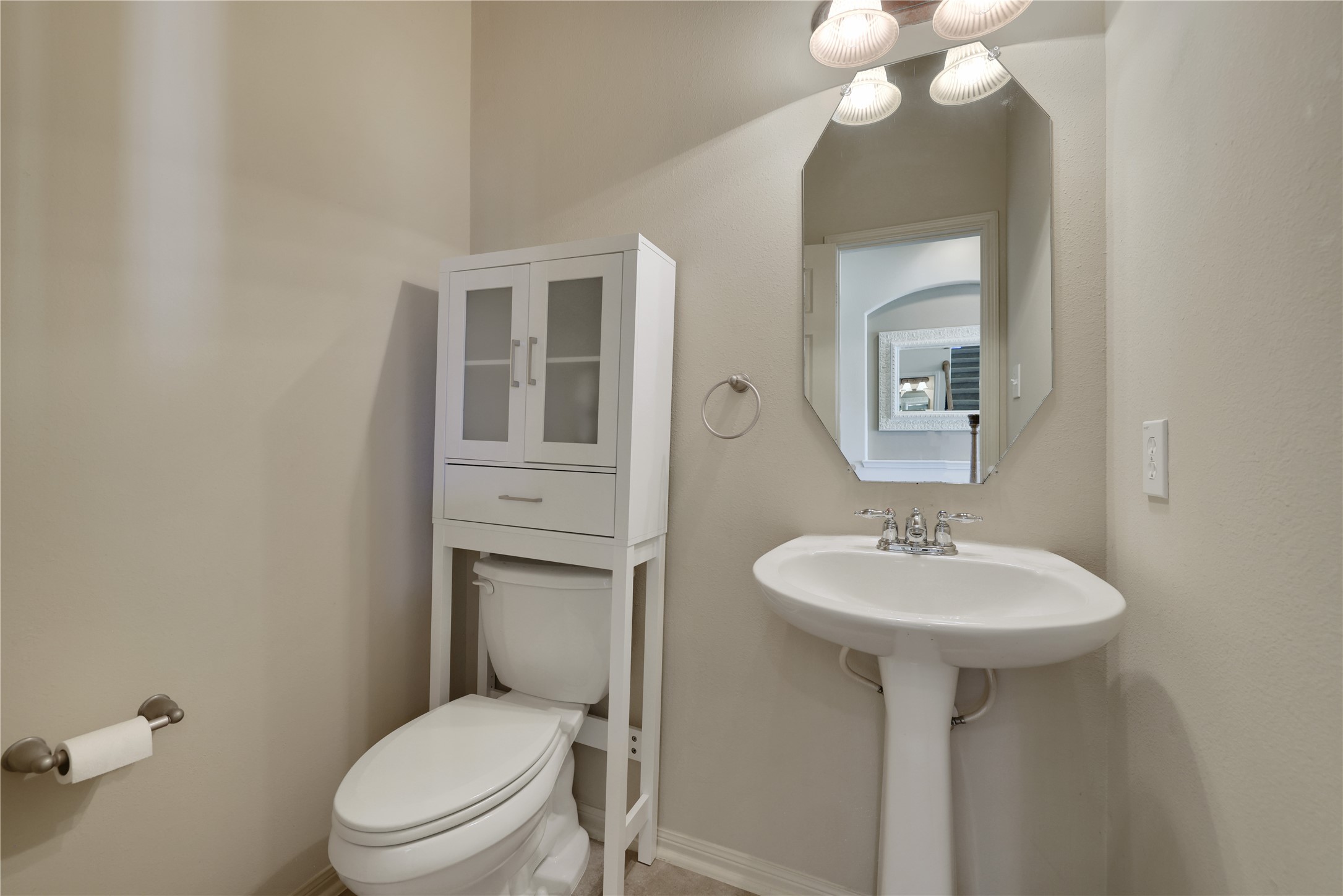 19815 Stanton Lake Drive Cypress, TX 77433 - Photo 12 of 50 a bathroom with a toilet sink and mirror
