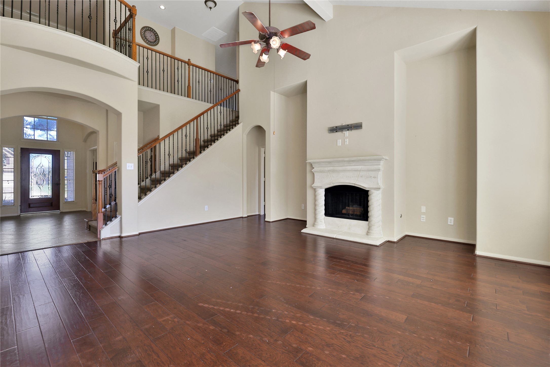 19815 Stanton Lake Drive Cypress, TX 77433 - Photo 16 of 50 a view of an empty room with wooden floor and a fireplace