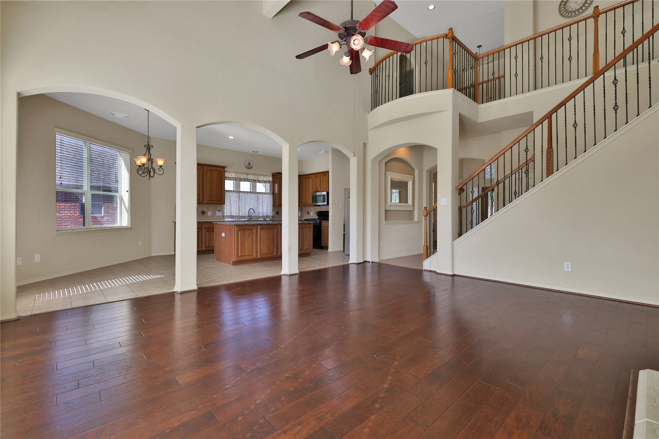 19815 Stanton Lake Drive Cypress, TX 77433 - Photo 17 of 50 a view of an entryway with wooden floor and a kitchen