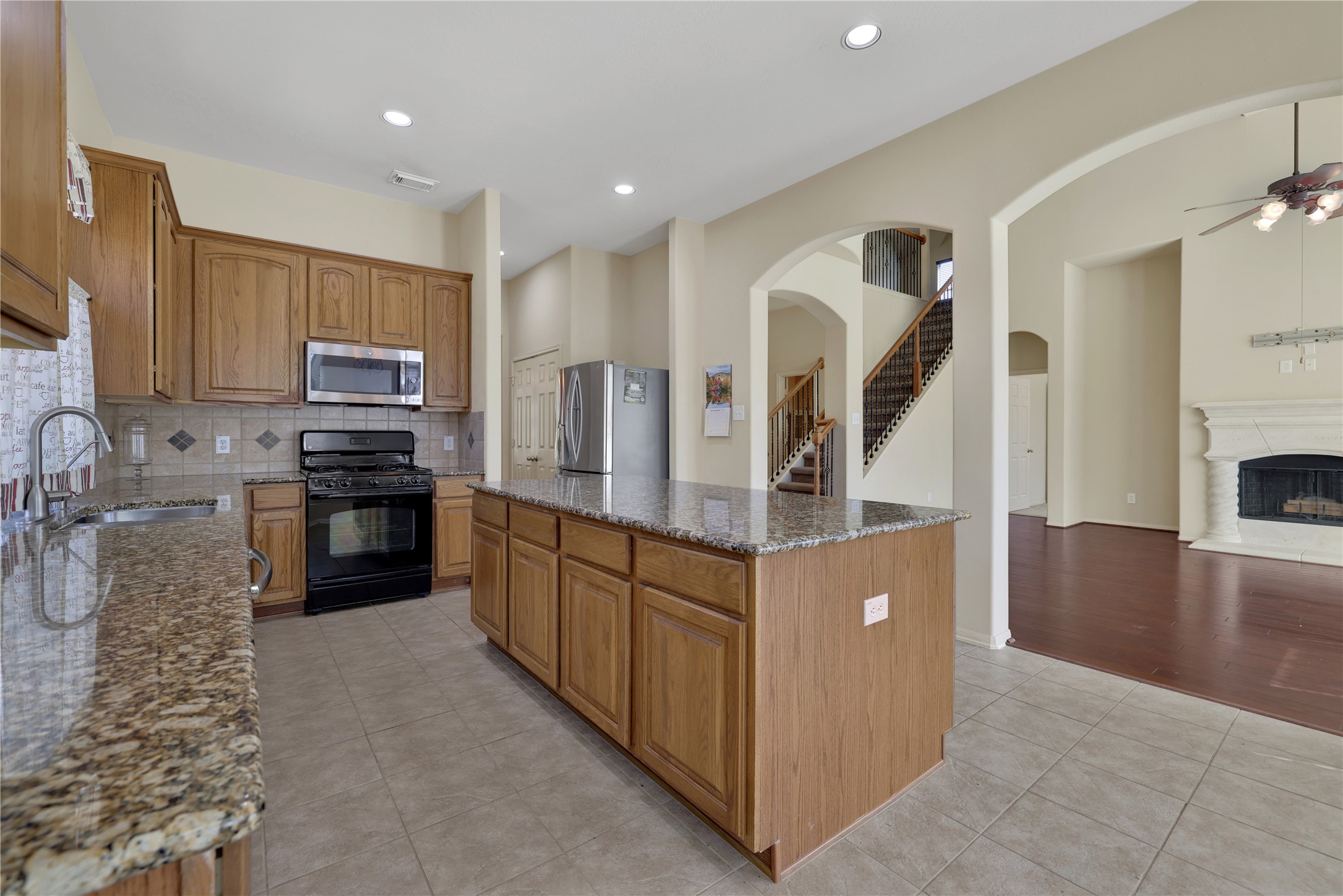 19815 Stanton Lake Drive Cypress, TX 77433 - Photo 24 of 50 a kitchen with stainless steel appliances granite countertop a refrigerator and a stove