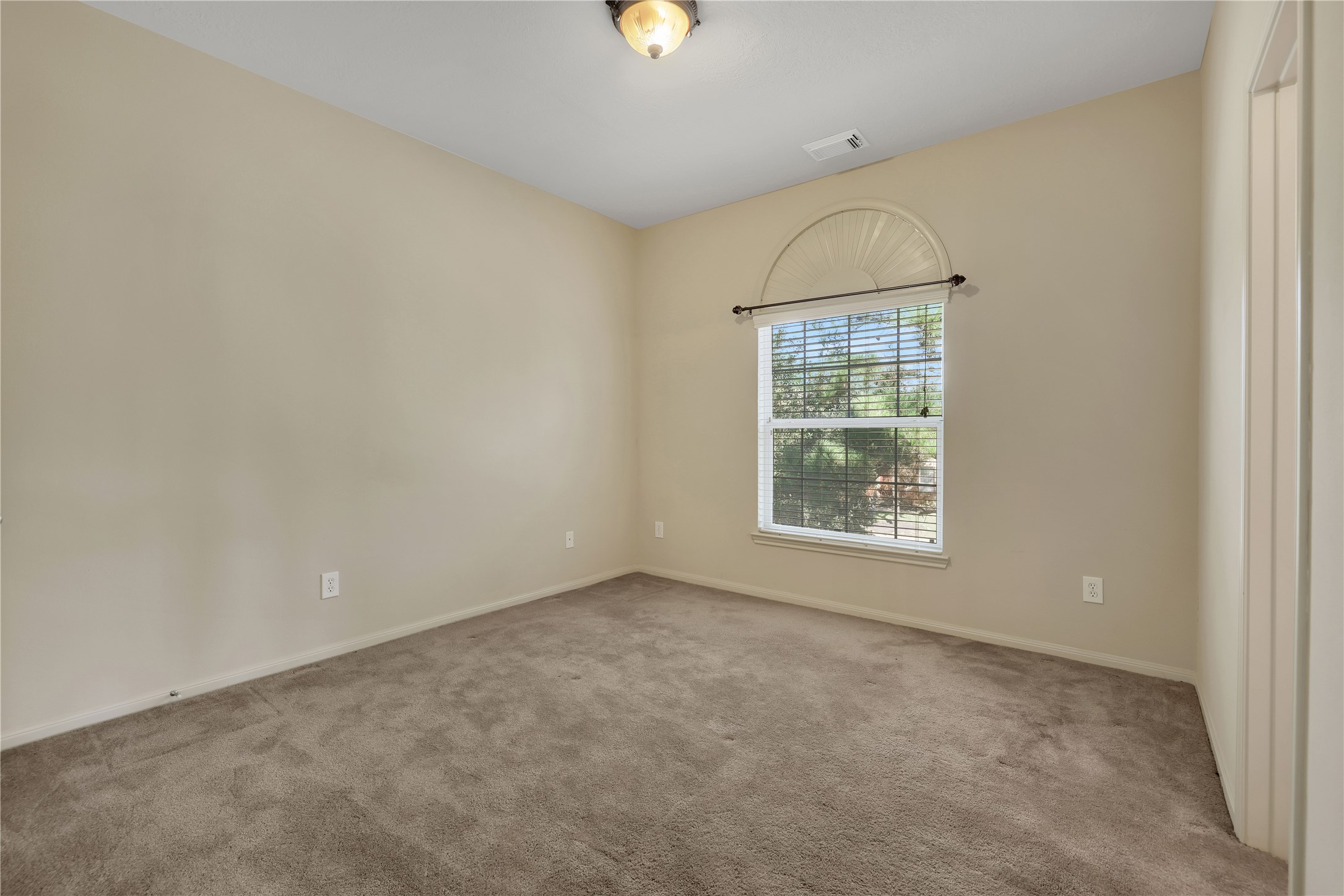 19815 Stanton Lake Drive Cypress, TX 77433 - Photo 32 of 50 an empty room with windows and natural light