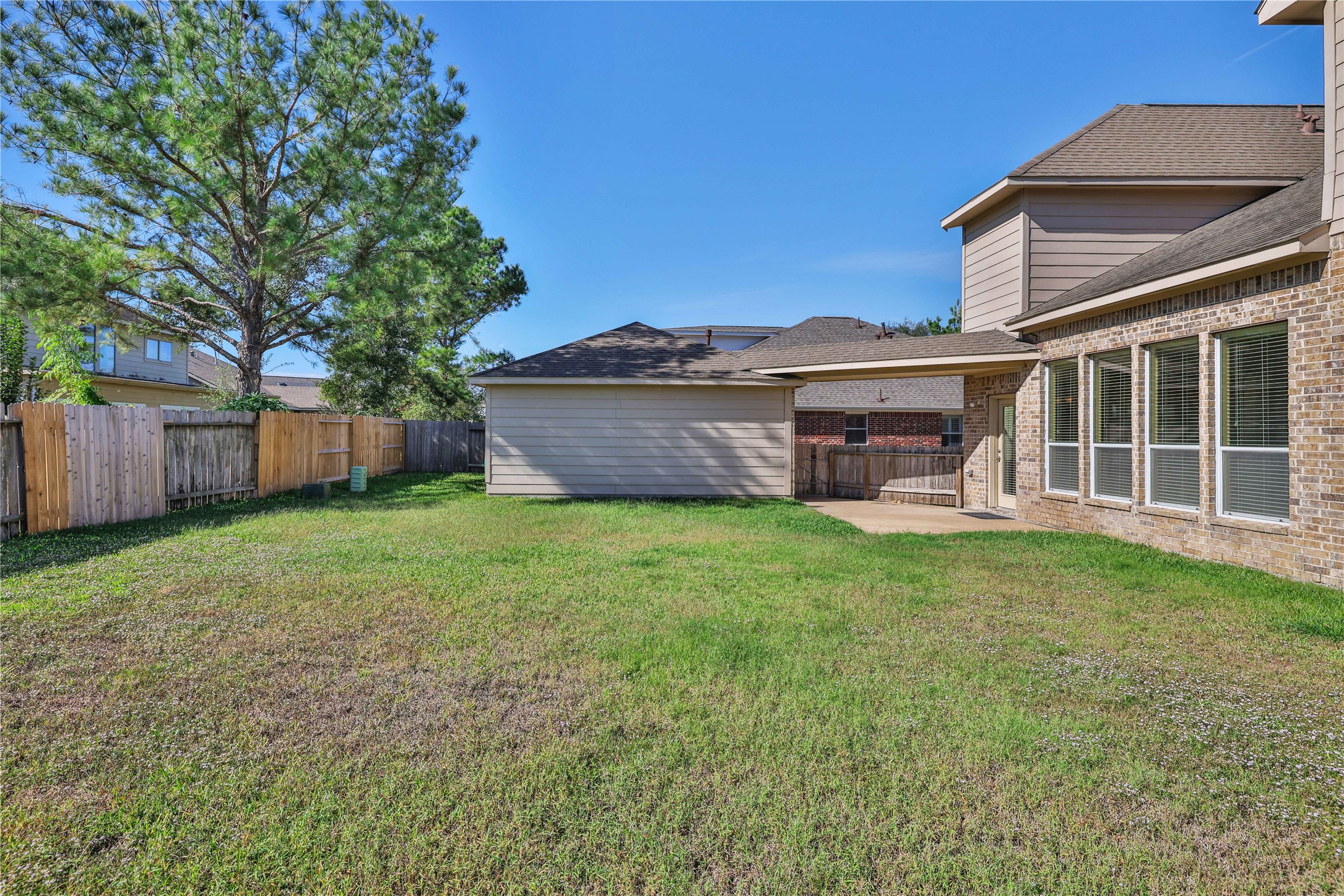 19815 Stanton Lake Drive Cypress, TX 77433 - Photo 49 of 50 a view of a house with a yard and a large tree