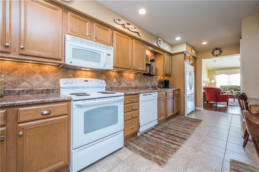5534 Lantern Hill Extension Pittsburgh, PA 15236 - Photo 11 of 33 a kitchen with white cabinets and white appliances