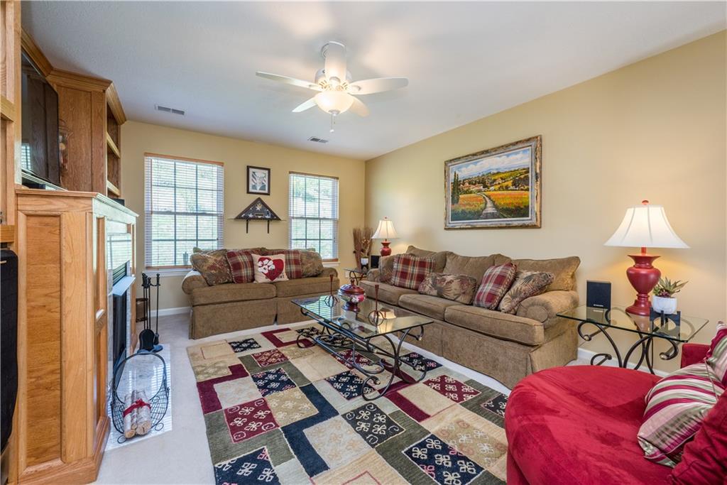 5534 Lantern Hill Extension Pittsburgh, PA 15236 - Photo 20 of 33 a living room with furniture and a chandelier