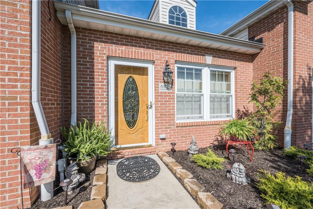 5534 Lantern Hill Extension Pittsburgh, PA 15236 - Photo 2 of 33 a front view of a house with a garden
