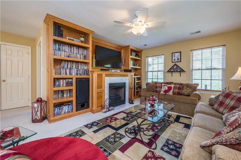 5534 Lantern Hill Extension Pittsburgh, PA 15236 - Photo 21 of 33 a living room with fireplace furniture and a flat screen tv