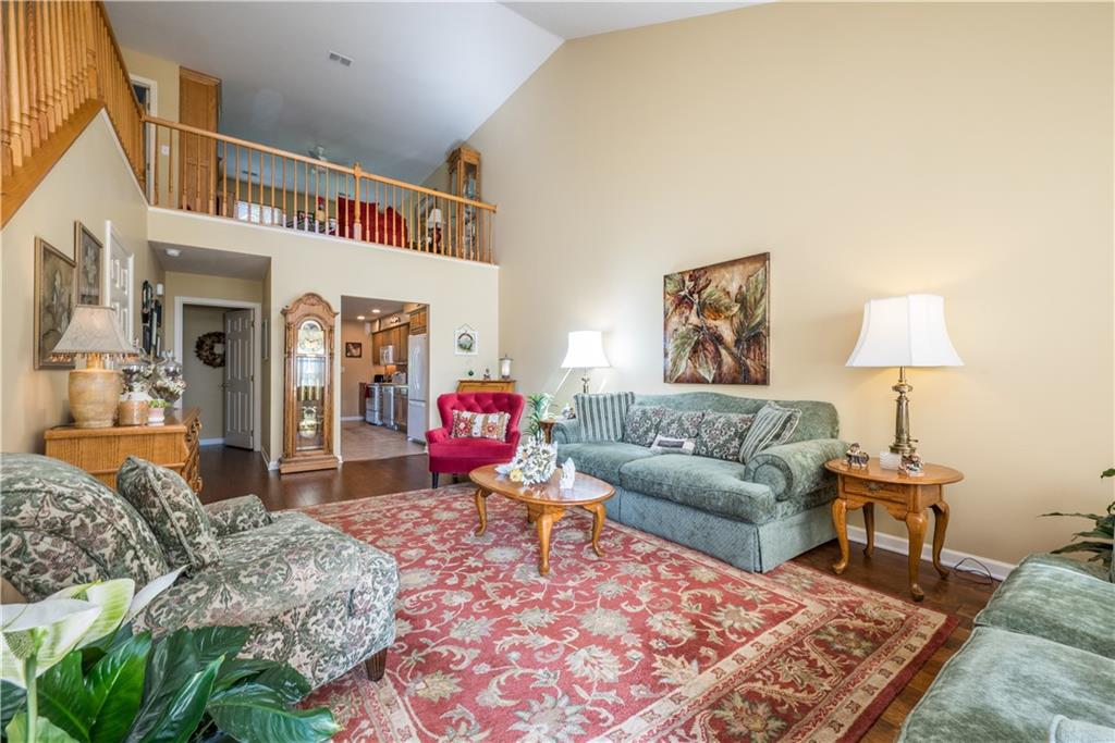 5534 Lantern Hill Extension Pittsburgh, PA 15236 - Photo 4 of 33 a living room with furniture a rug and a lamp