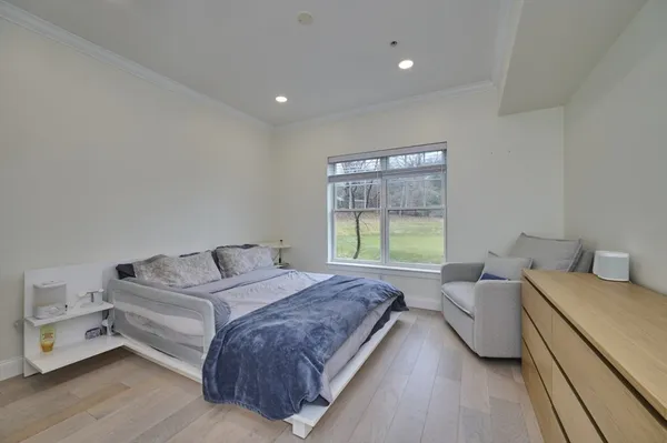 a spacious bedroom with a bed and a couch