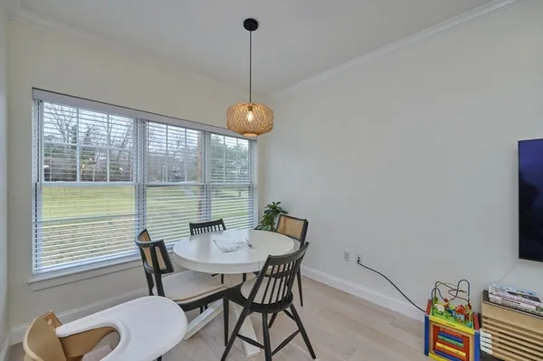 a view of a dining room with furniture window and outside view