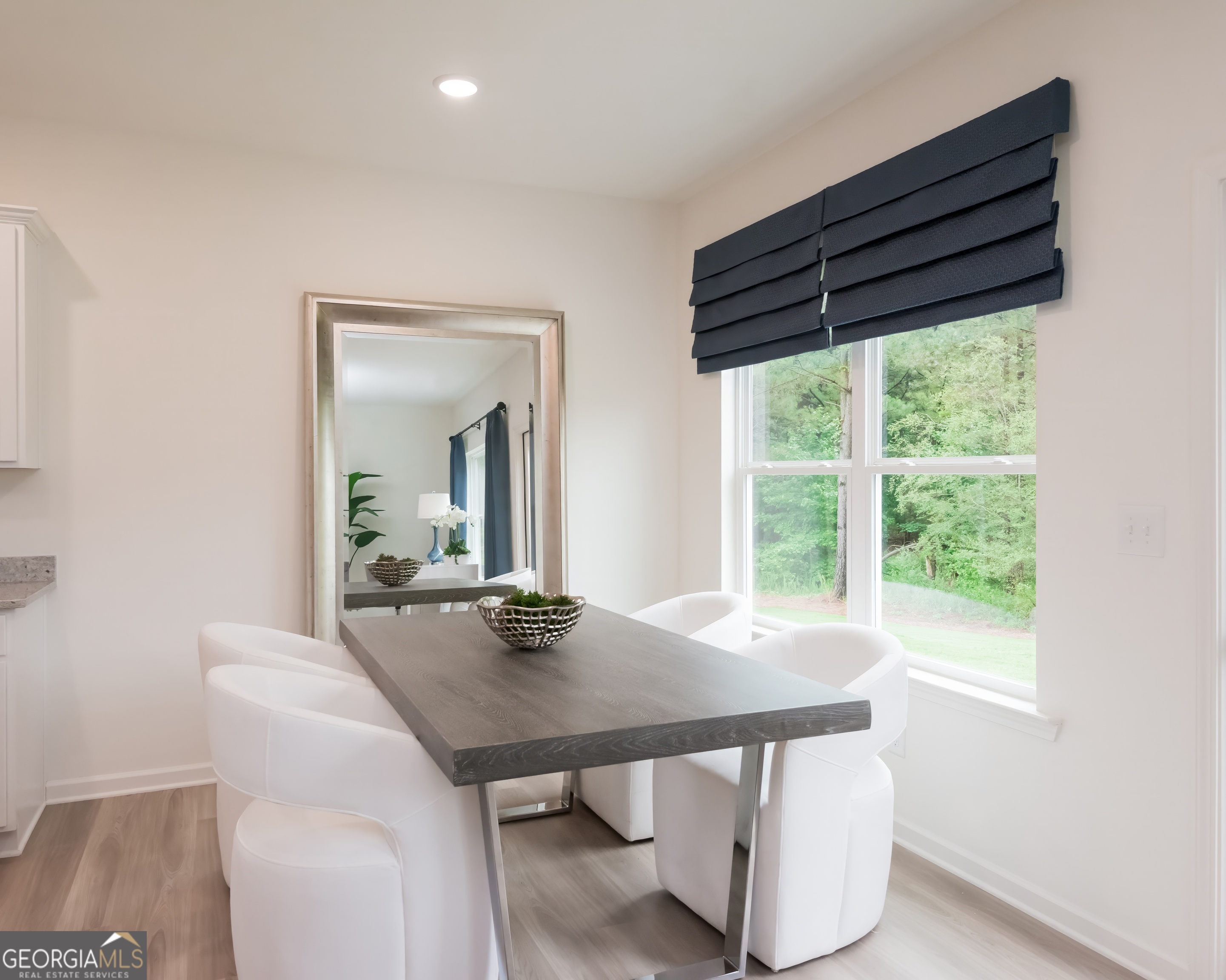 2553 Riverside Court Northeast Conyers, GA 30013 - Photo 16 of 40 a view of a dining room with furniture window and outside view