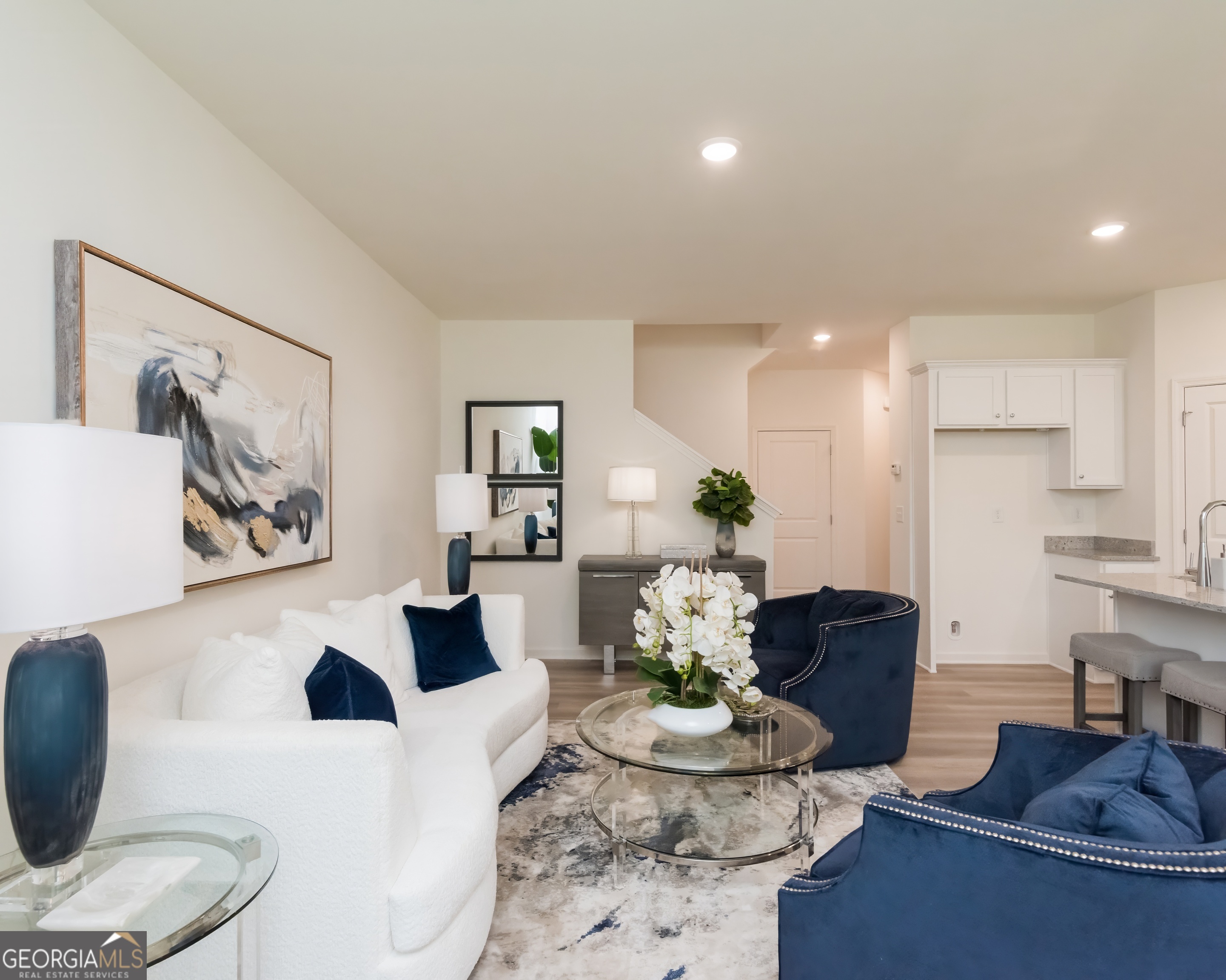 2553 Riverside Court Northeast Conyers, GA 30013 - Photo 17 of 40 a living room with furniture and wooden floor
