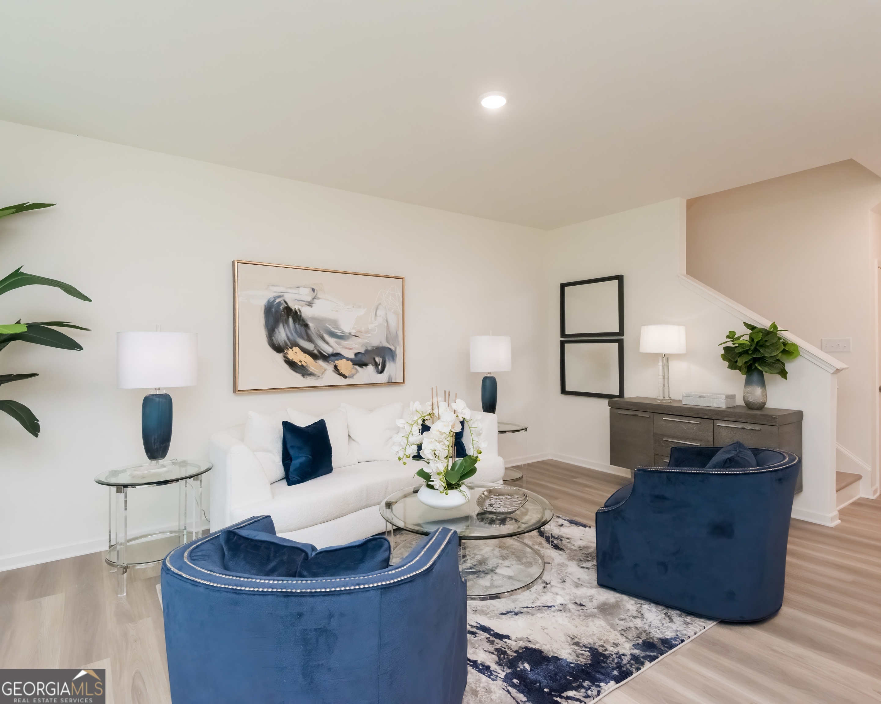 2553 Riverside Court Northeast Conyers, GA 30013 - Photo 18 of 40 a living room with furniture and a potted plant