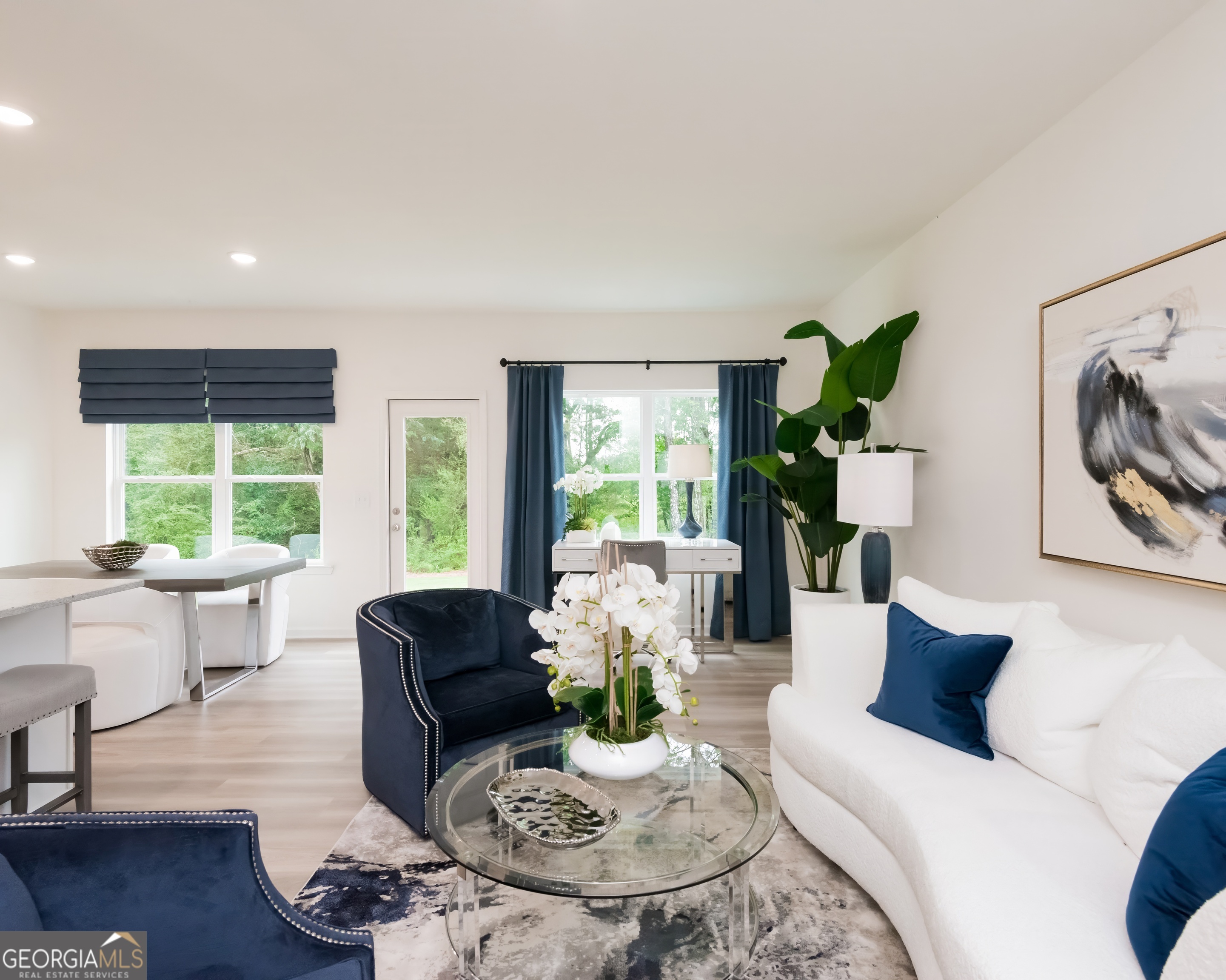 2553 Riverside Court Northeast Conyers, GA 30013 - Photo 19 of 40 a living room with furniture and a wooden floor