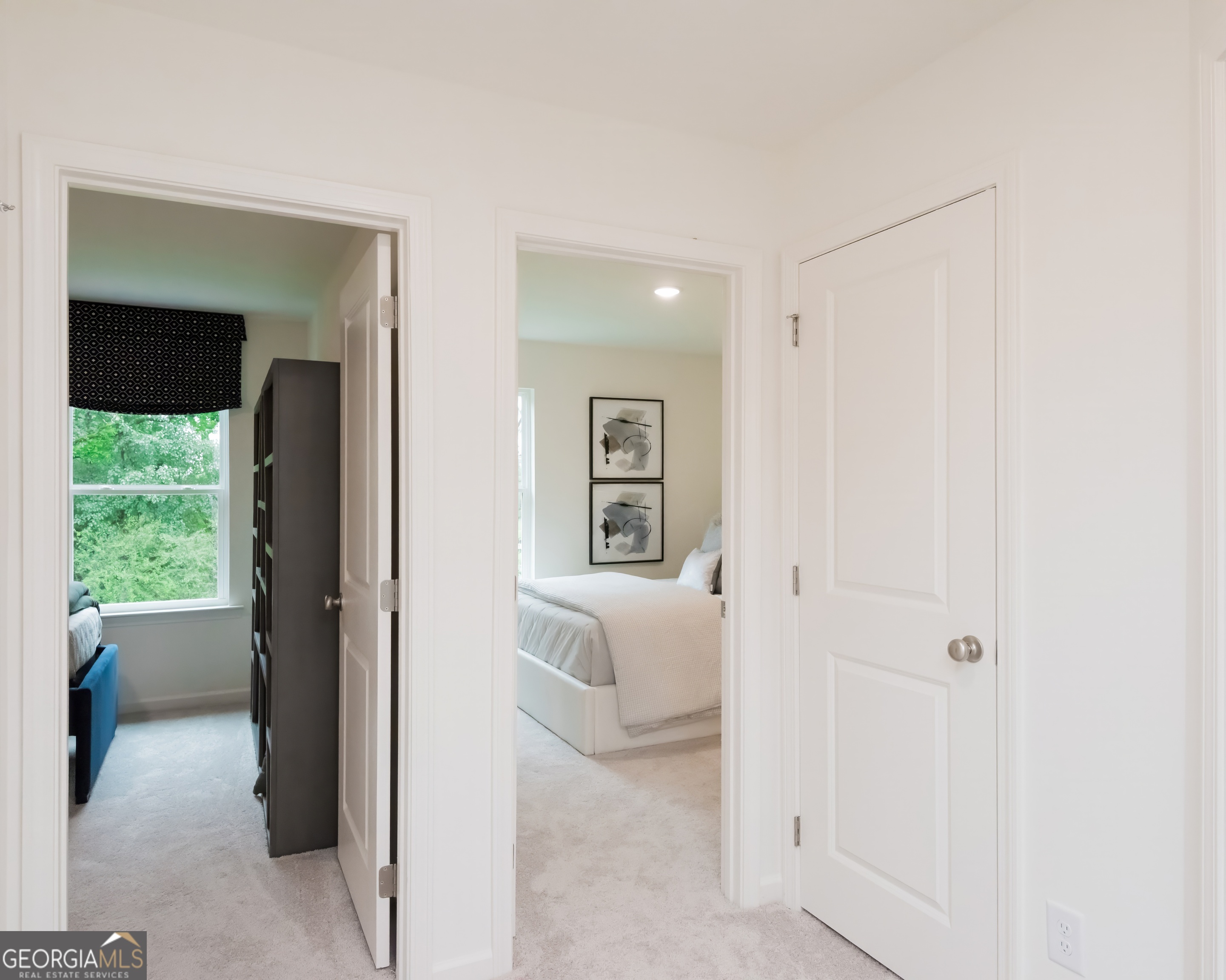 2553 Riverside Court Northeast Conyers, GA 30013 - Photo 25 of 40 a view of a hallway with wooden floor and a living room