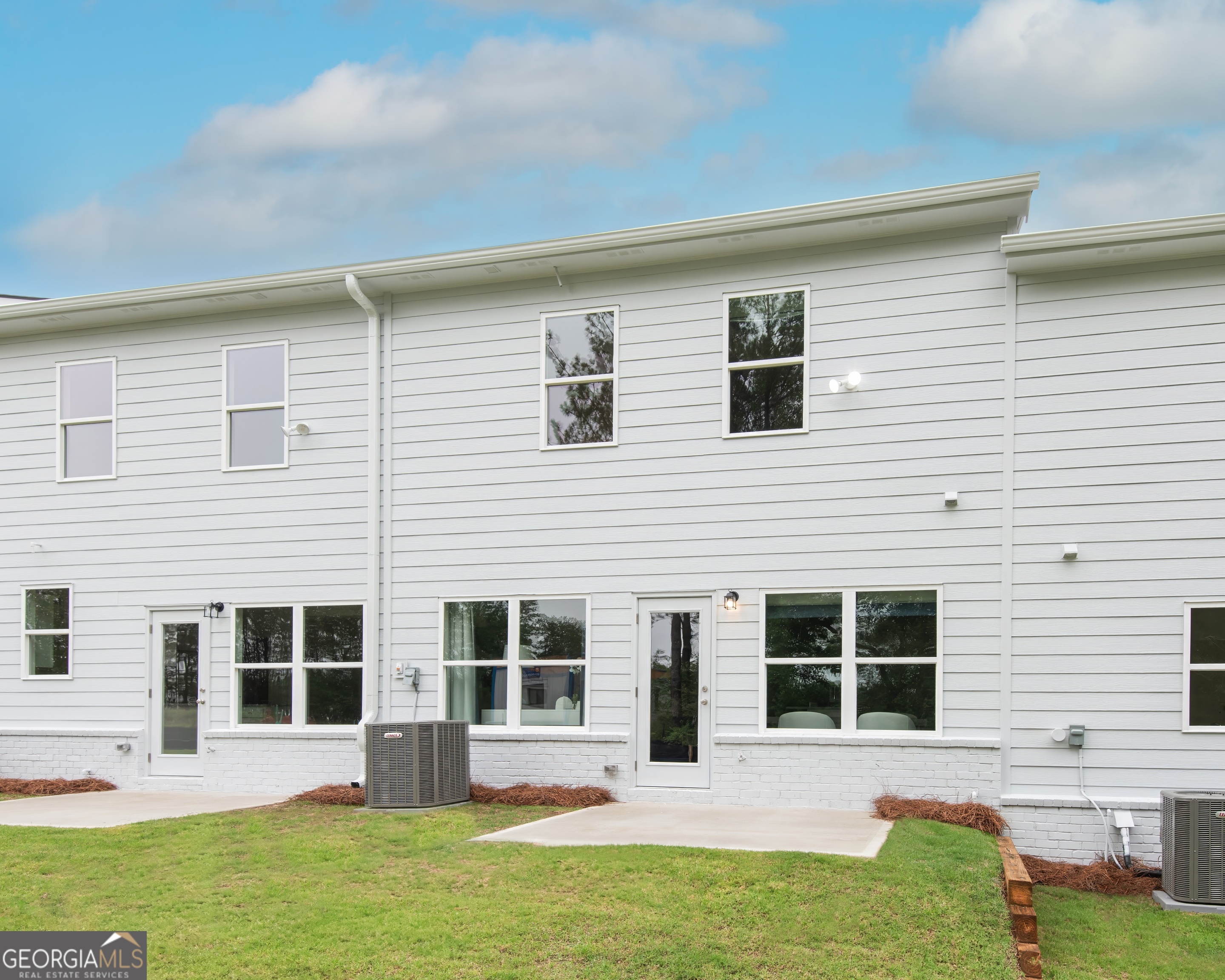 2553 Riverside Court Northeast Conyers, GA 30013 - Photo 31 of 40 a house view with a garden space
