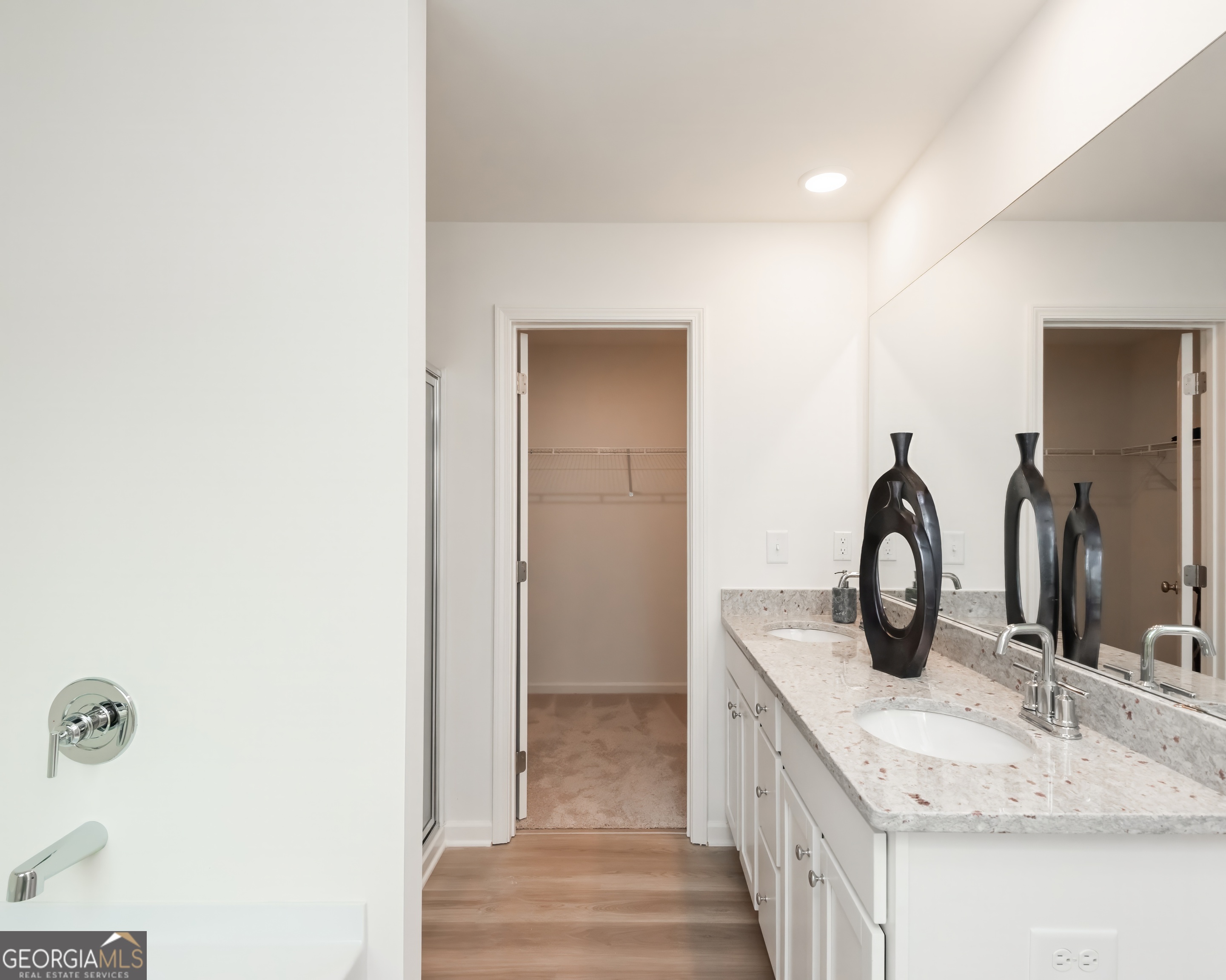 2553 Riverside Court Northeast Conyers, GA 30013 - Photo 36 of 40 a bathroom with a granite countertop sink and a mirror