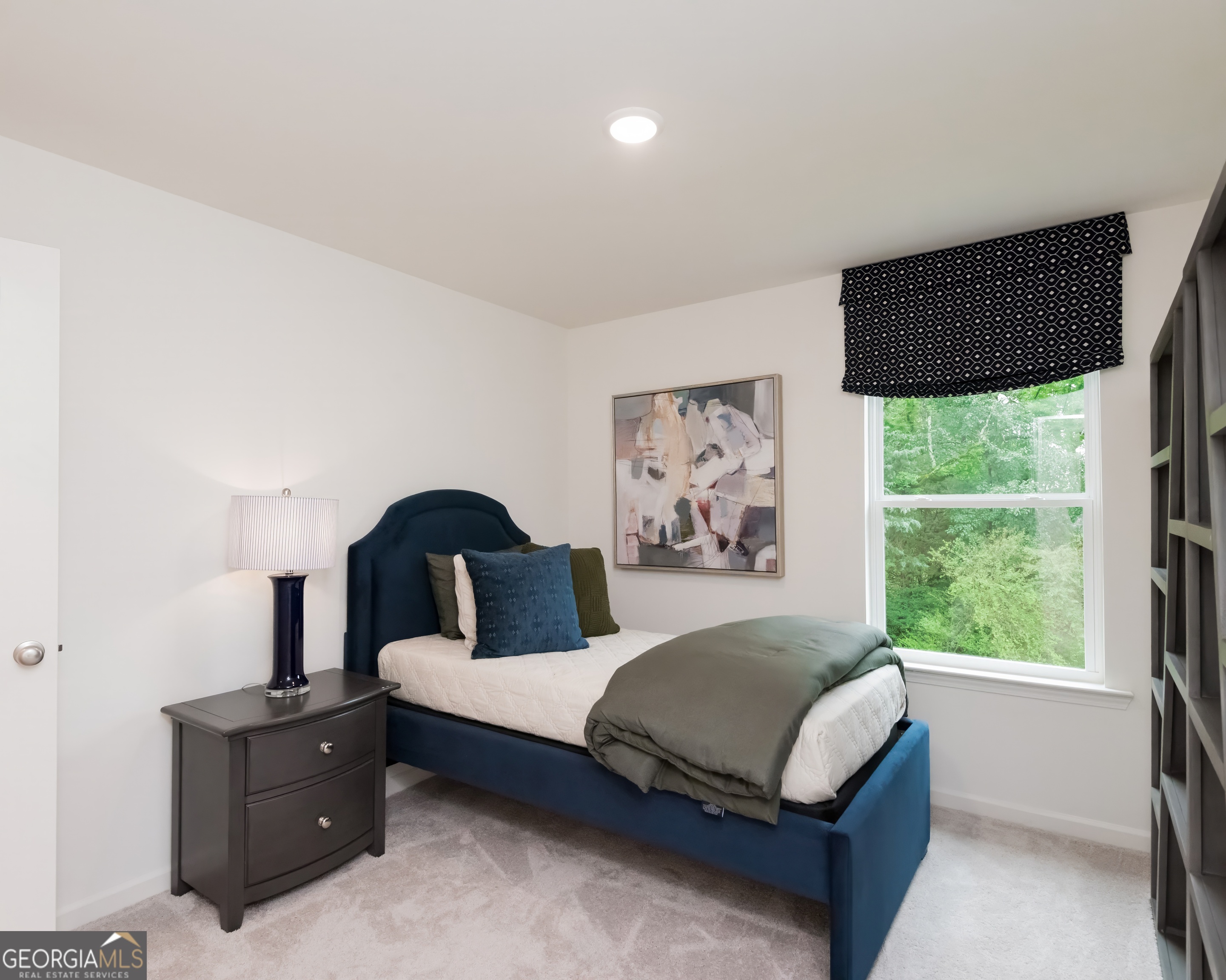 2553 Riverside Court Northeast Conyers, GA 30013 - Photo 40 of 40 a bedroom with a bed and window