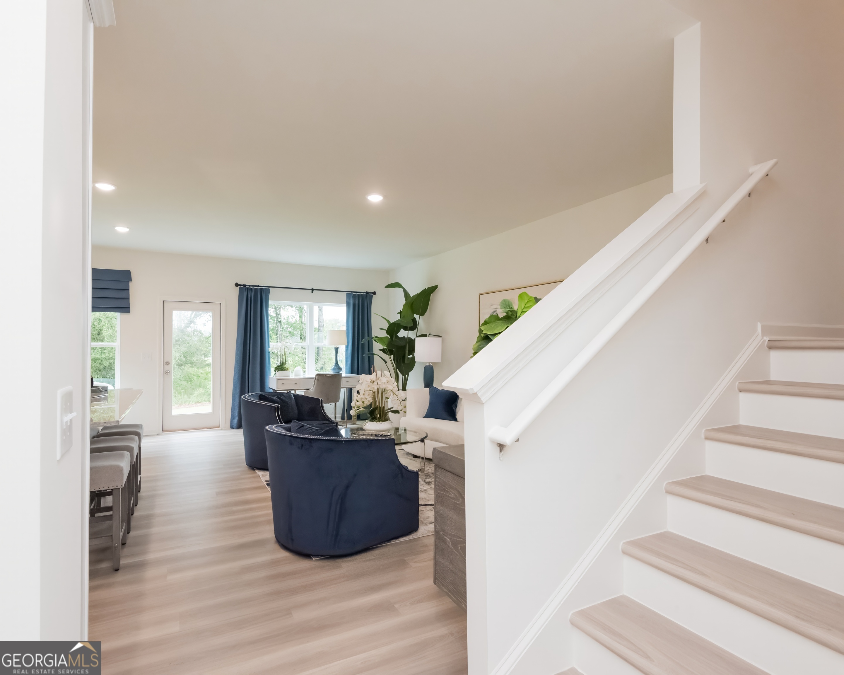 2553 Riverside Court Northeast Conyers, GA 30013 - Photo 4 of 40 a living room with furniture and large windows